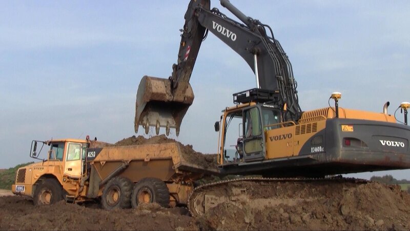 Excavator Loading Truck — Yellow