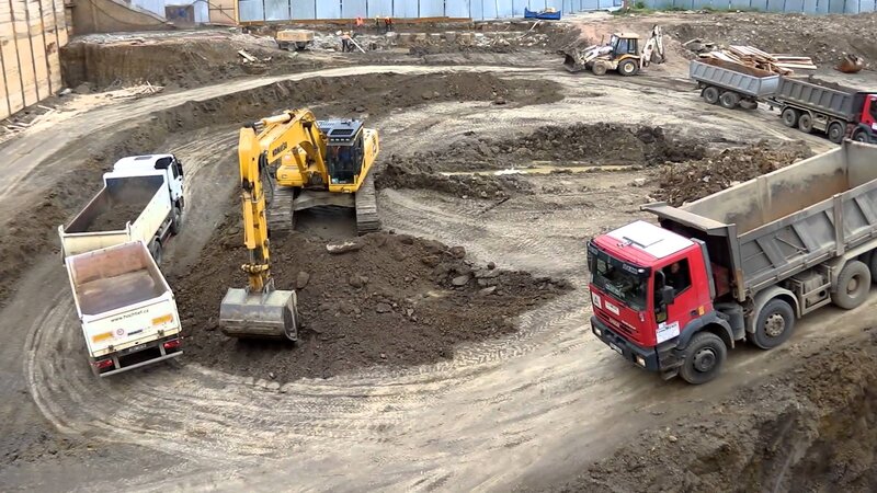 Excavator Loading Trucks
