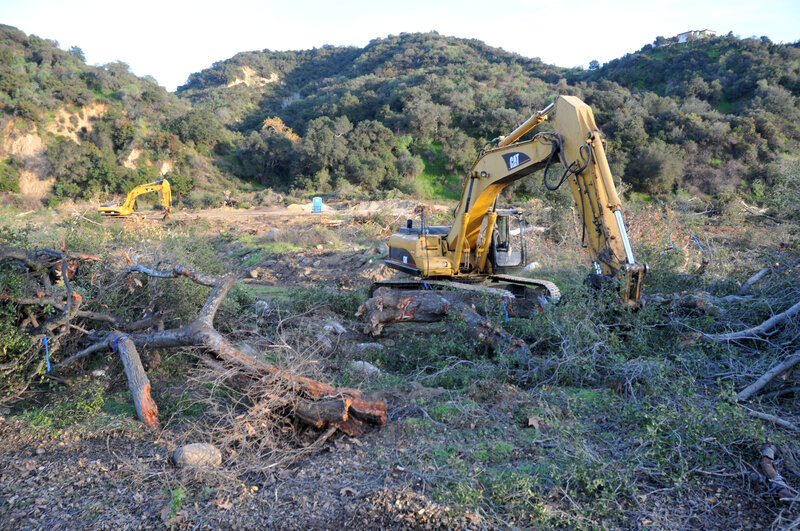 Excavators Clearing Land