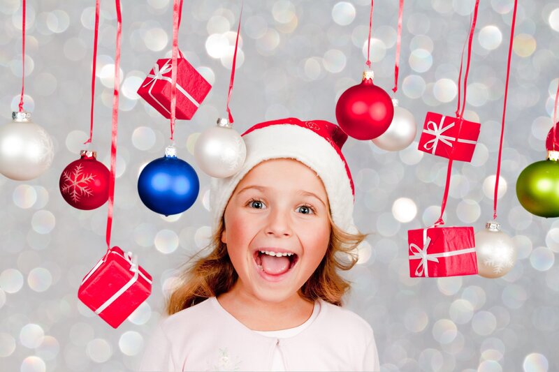 excited girl with christmas ornaments