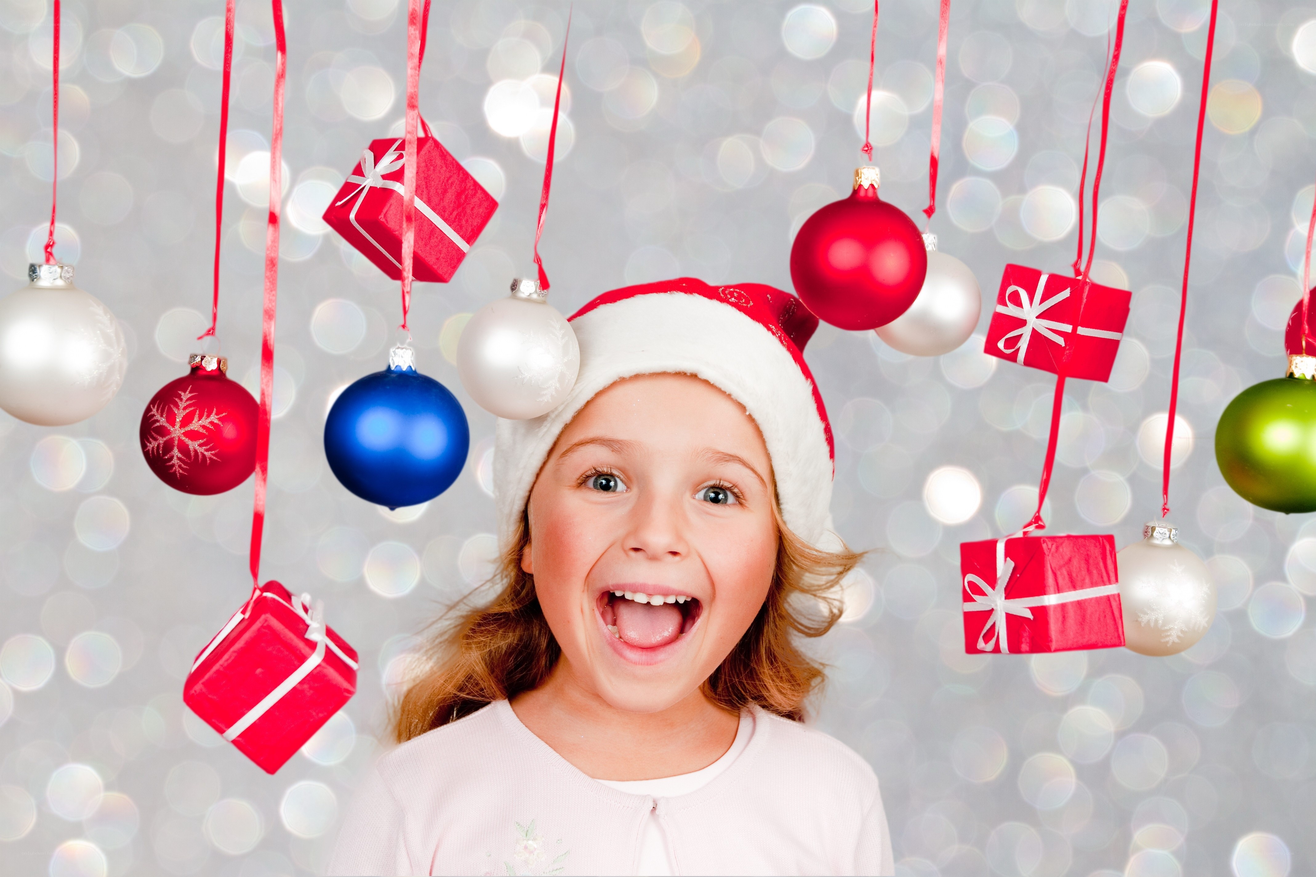 excited girl with christmas ornaments