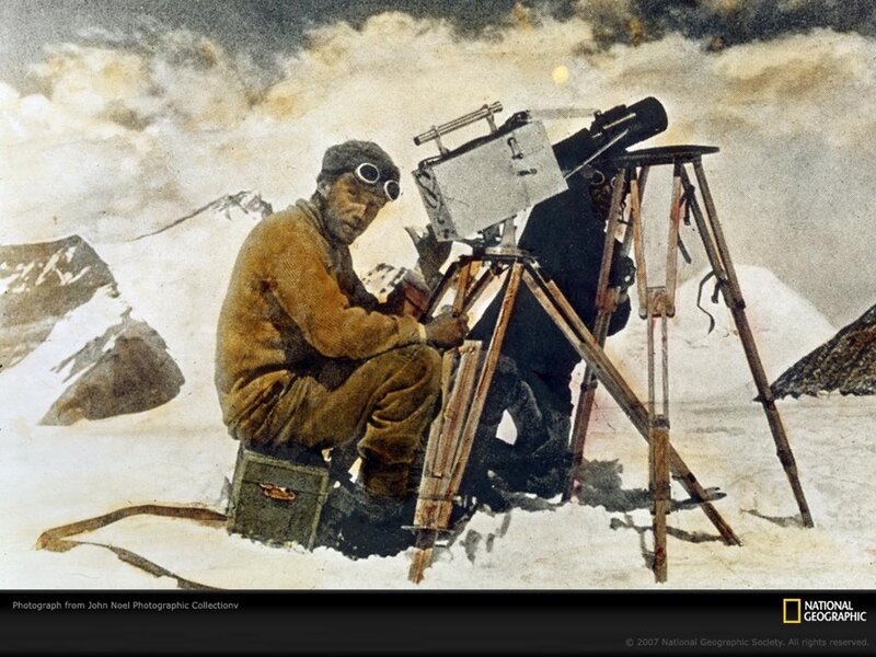 Explorer with camera in snow