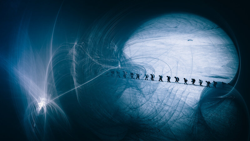 Explorers in a glowing tunnel