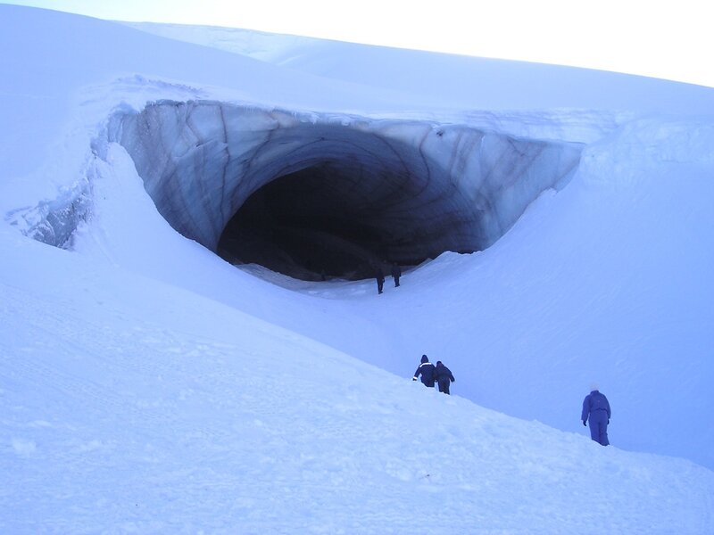 Explorers near ice cave entrance