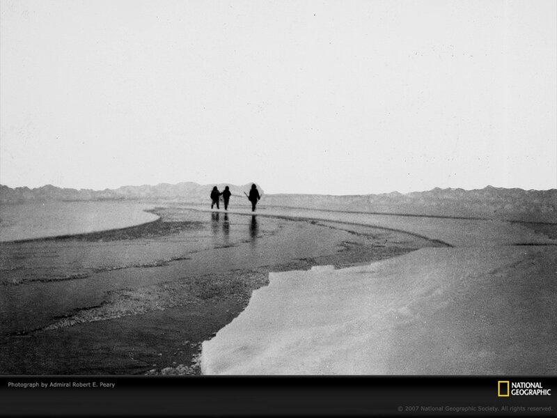 Explorers on icy shore