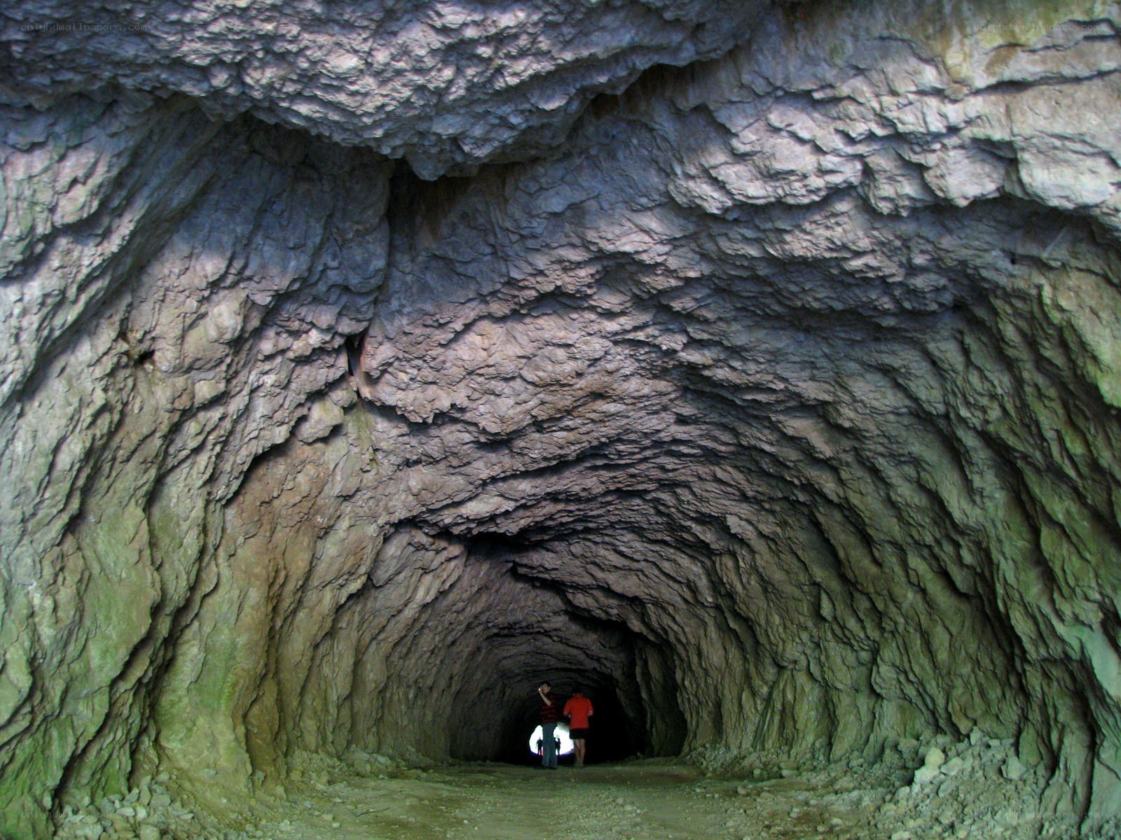 Exploring a rocky cave tunnel