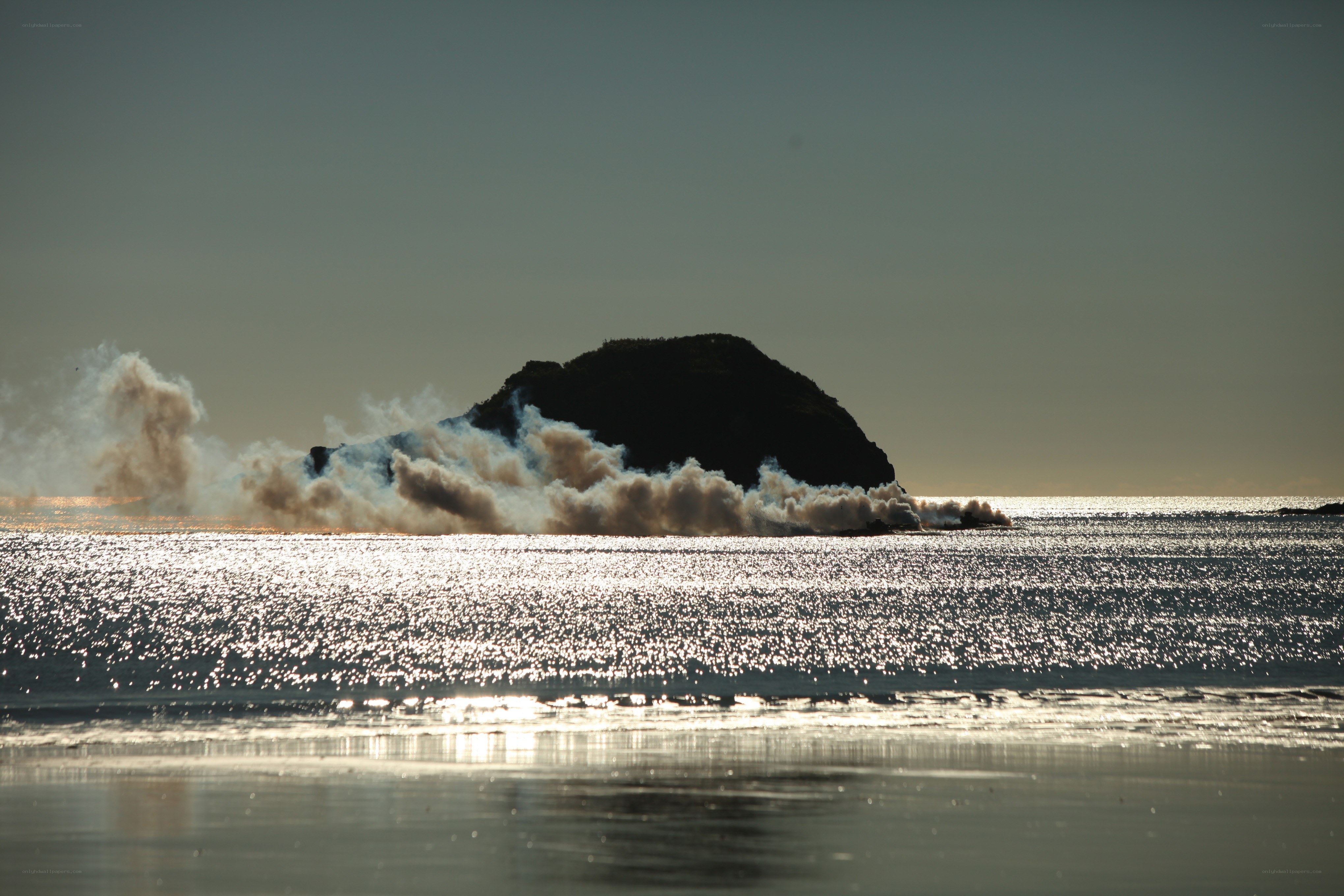 Explosion near rocky island