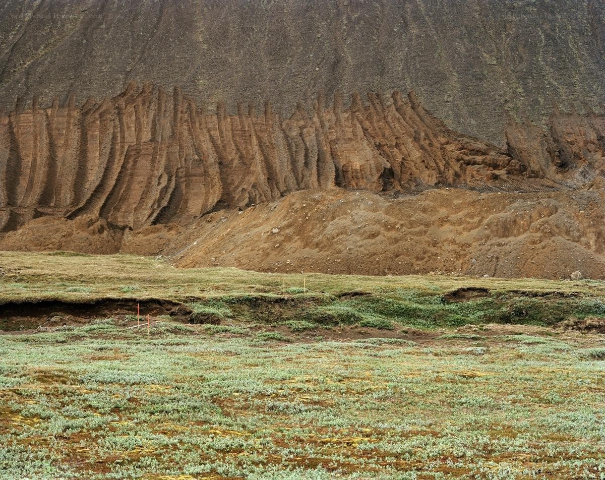 Exposed rock layers in tundra