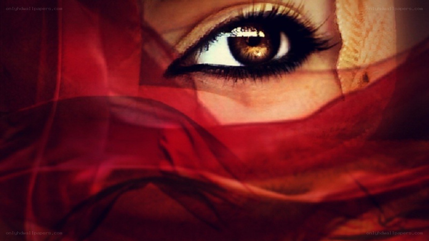 eye behind red fabric