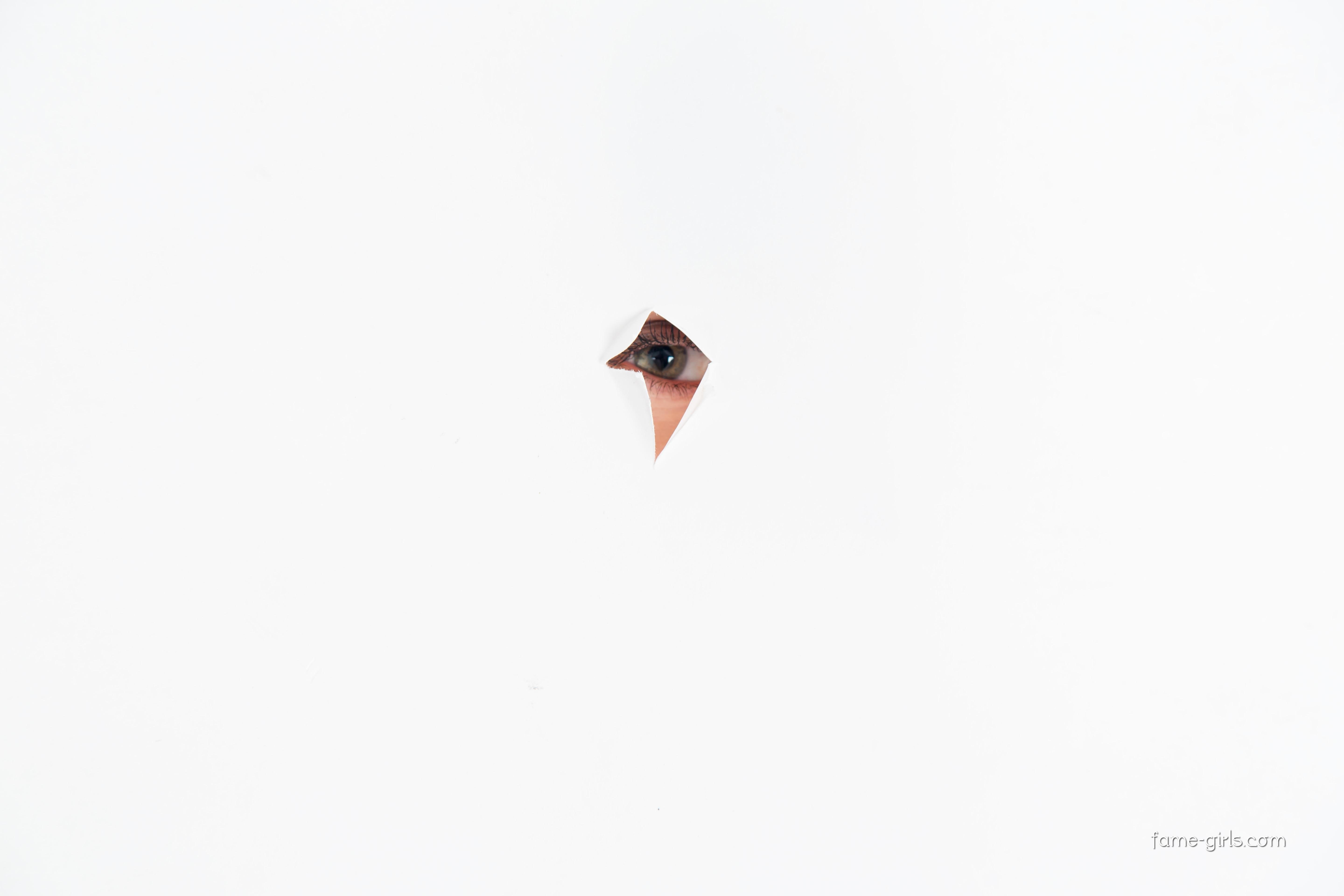 eye peeking through hole
