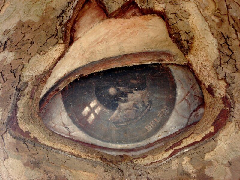 eye sculpture with ship painting