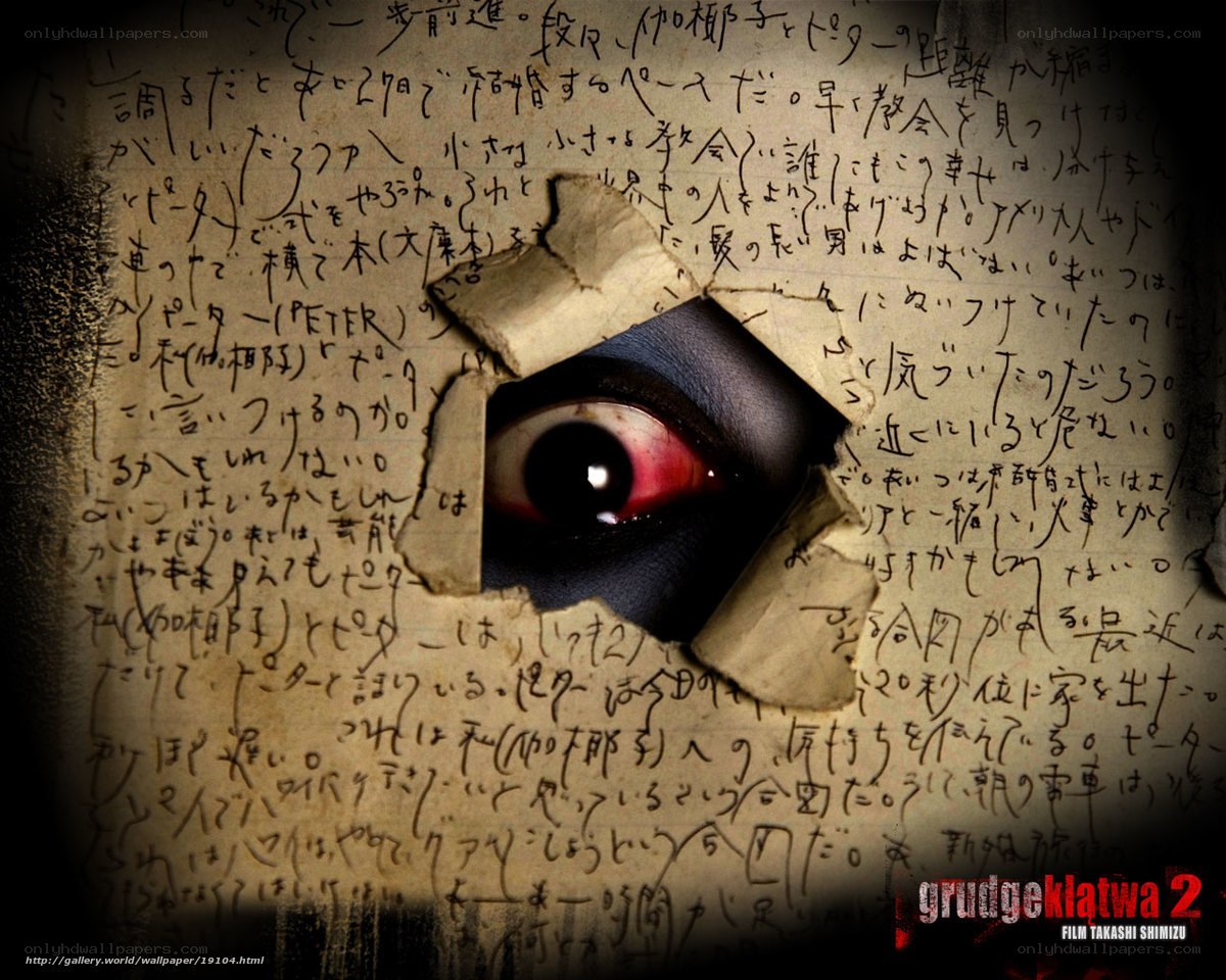 eye through torn paper