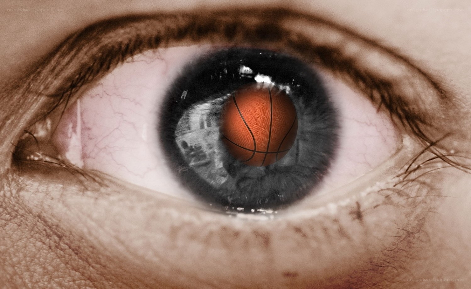 eye with basketball reflection