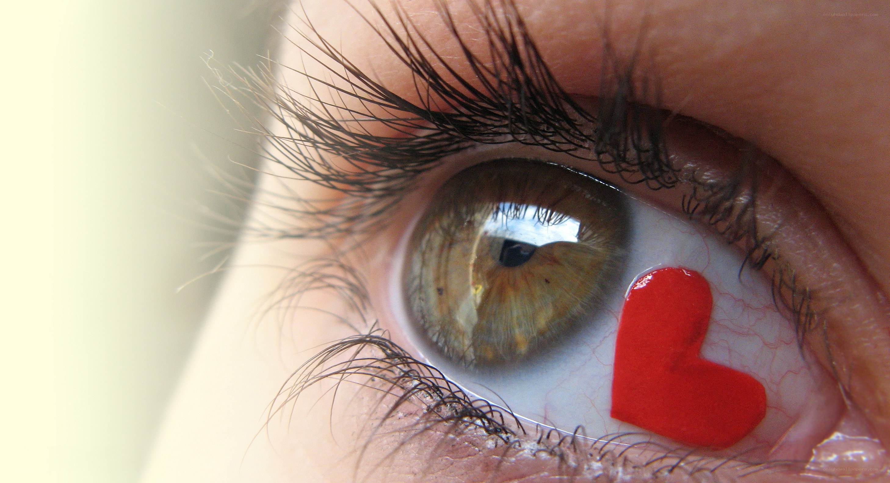 eye with red heart symbol