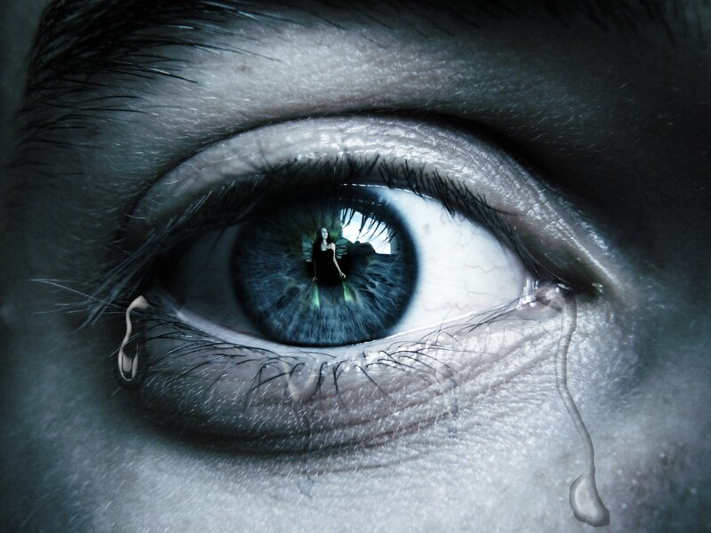 eye with tear and reflection