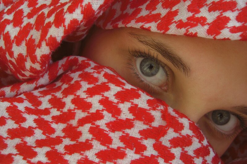 eyes behind red cloth