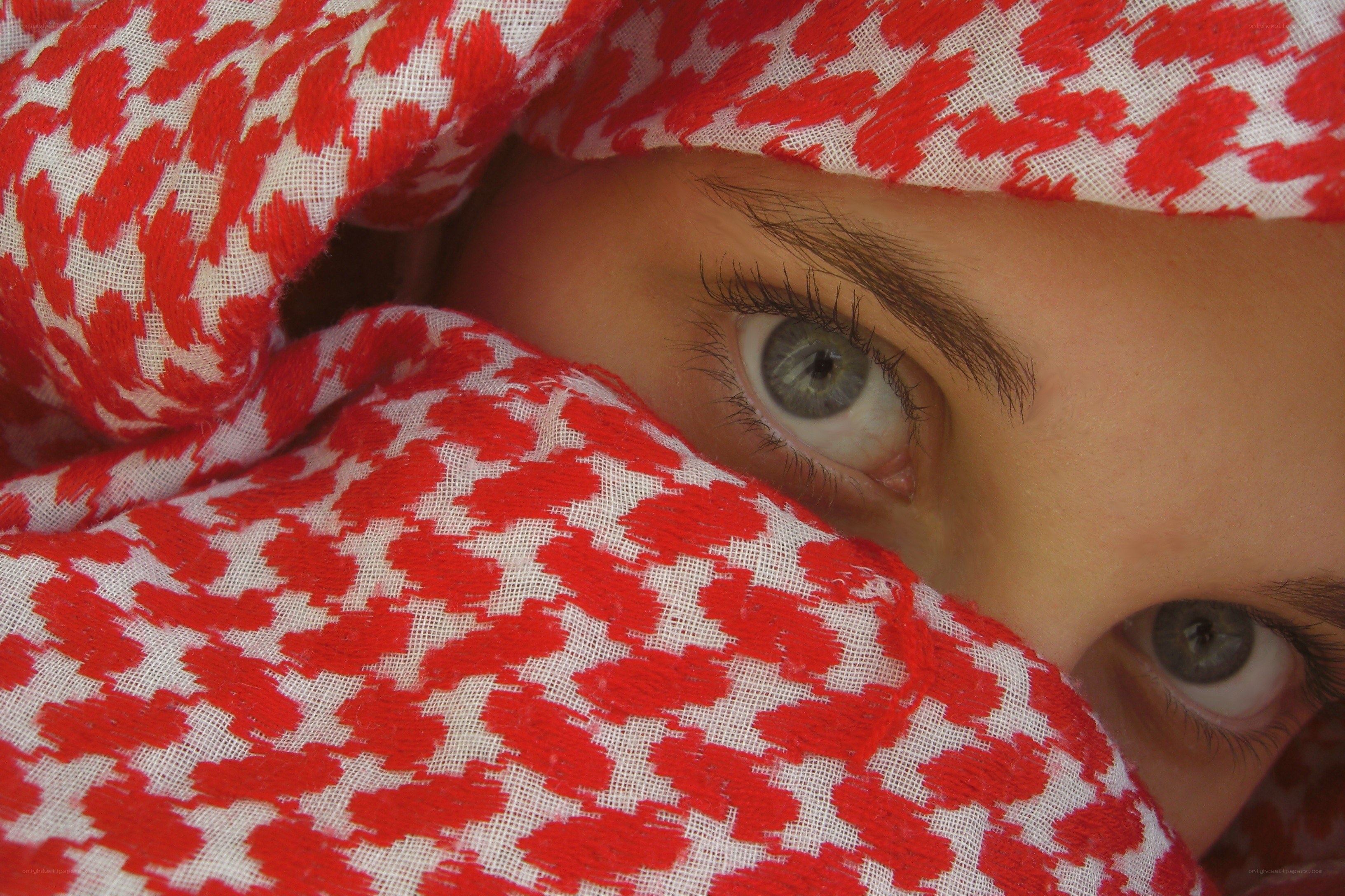eyes behind red cloth