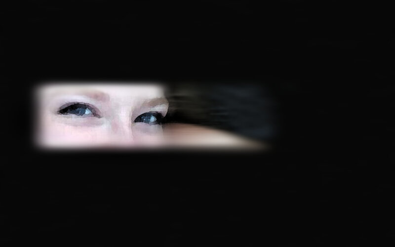 eyes peeking from darkness