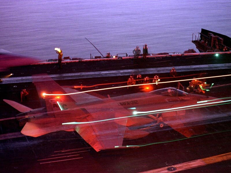 F-14 jet on aircraft carrier deck