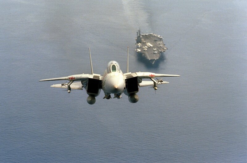 F-14 Tomcat near aircraft carrier