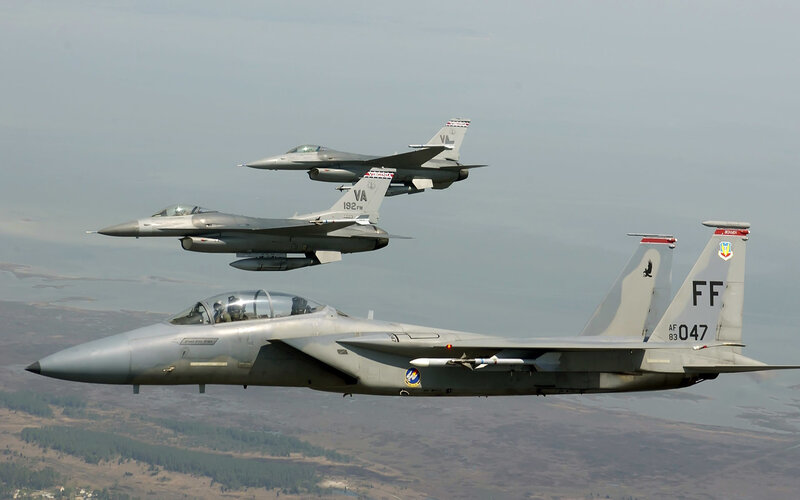 F-15 and F-16 fighter jets in formation