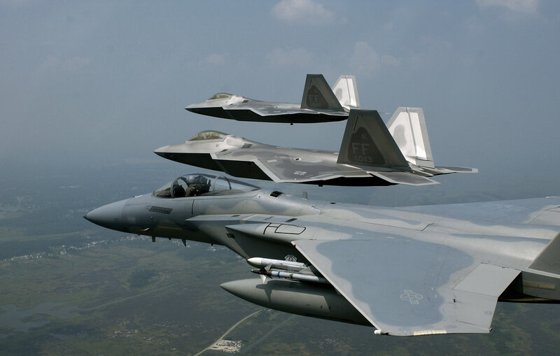 F-15 and F-22 fighter jets in formation