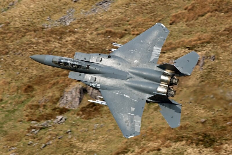 F-15 Eagle Fighter Jet — Gray, Dynamic, Afternoon, Photograph, Aircraft, Mountainous Terrain