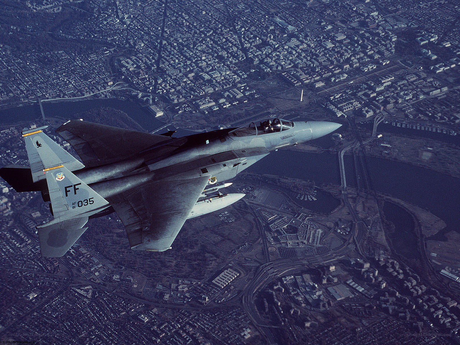 F-15 Eagle over city