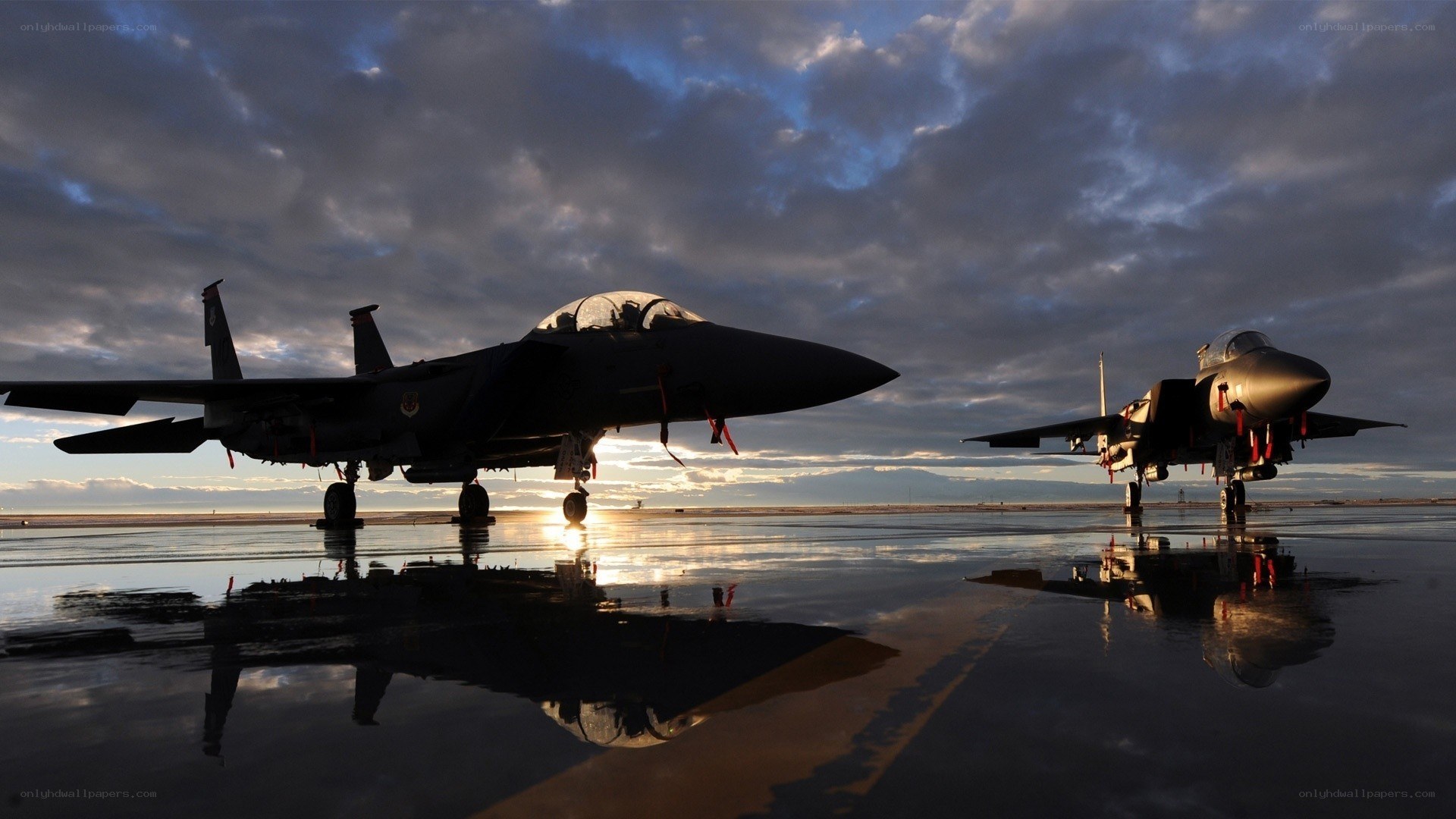 F-15 Eagles on wet tarmac