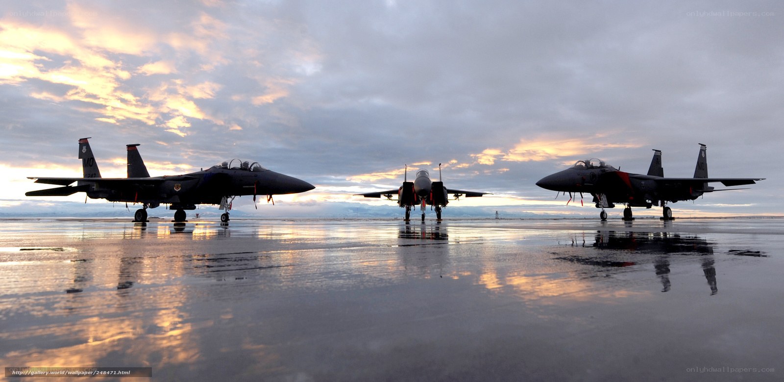 F-15 Eagles on wet tarmac