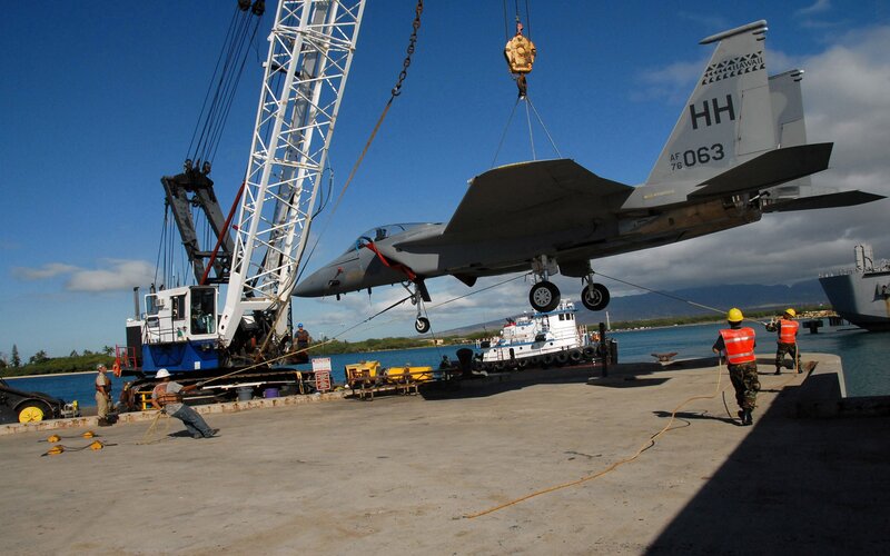 F-15 fighter jet being lifted at port