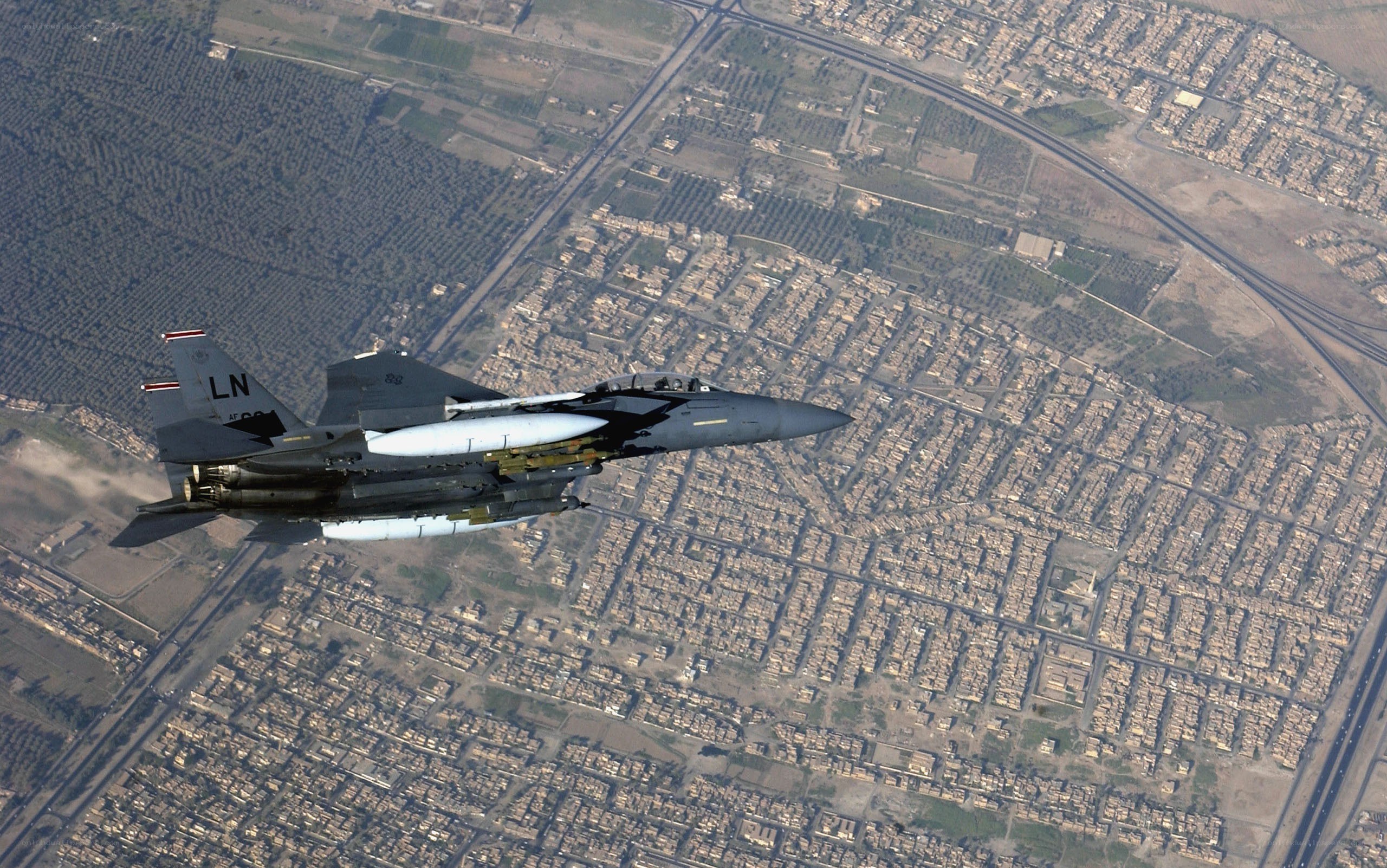 F-15 fighter jet over city