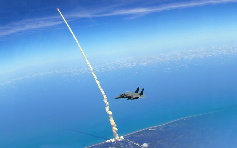 F-15 fighter jet with rocket launch