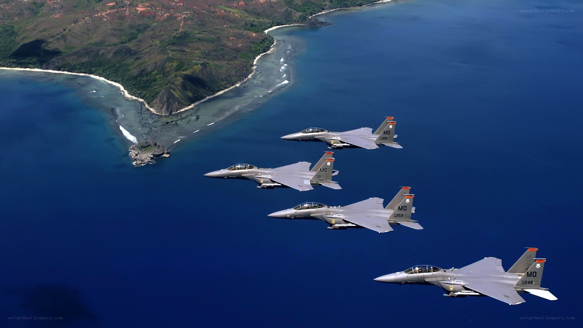 F-15 fighter jets over coastline