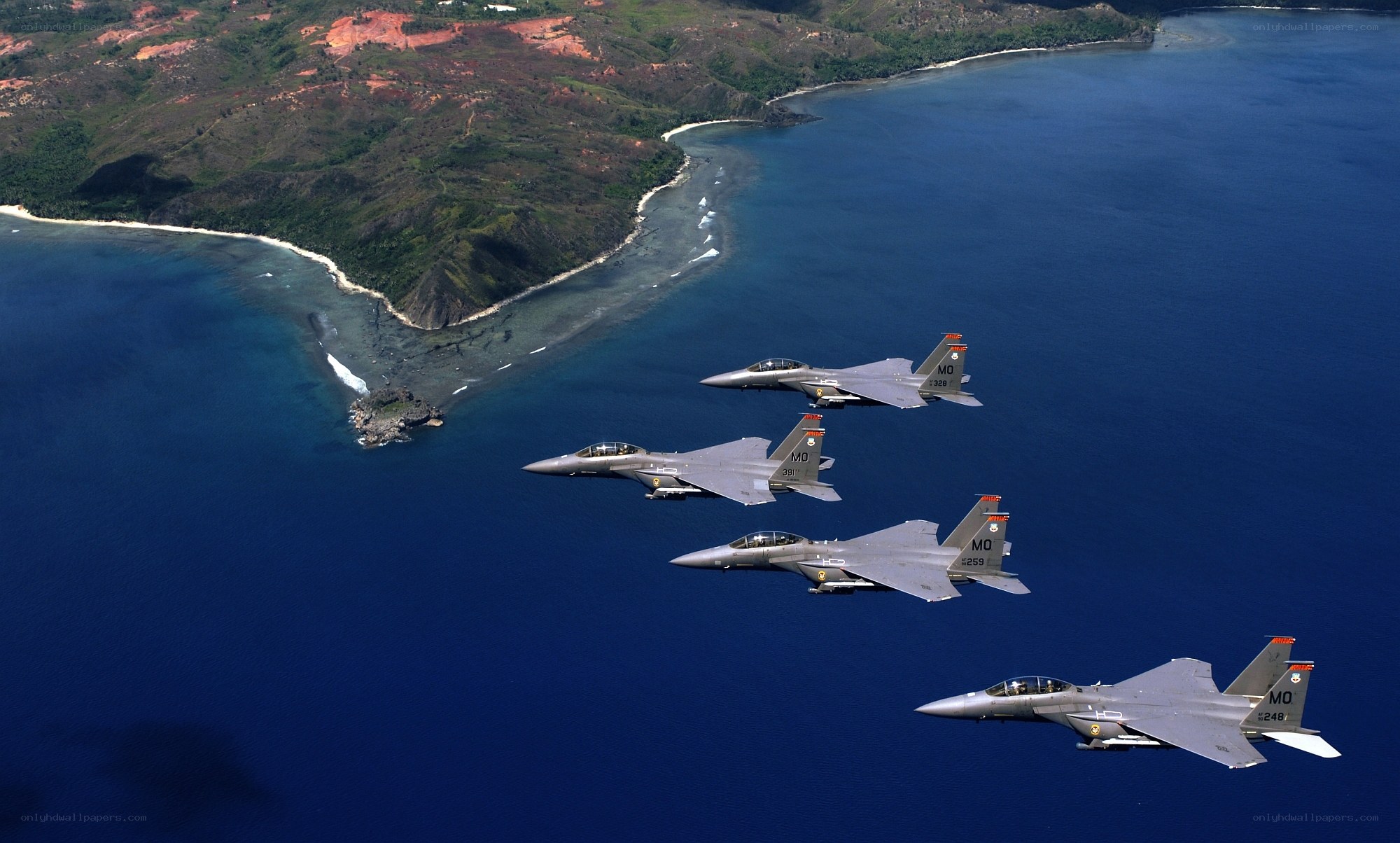 F-15 fighter jets over coastline