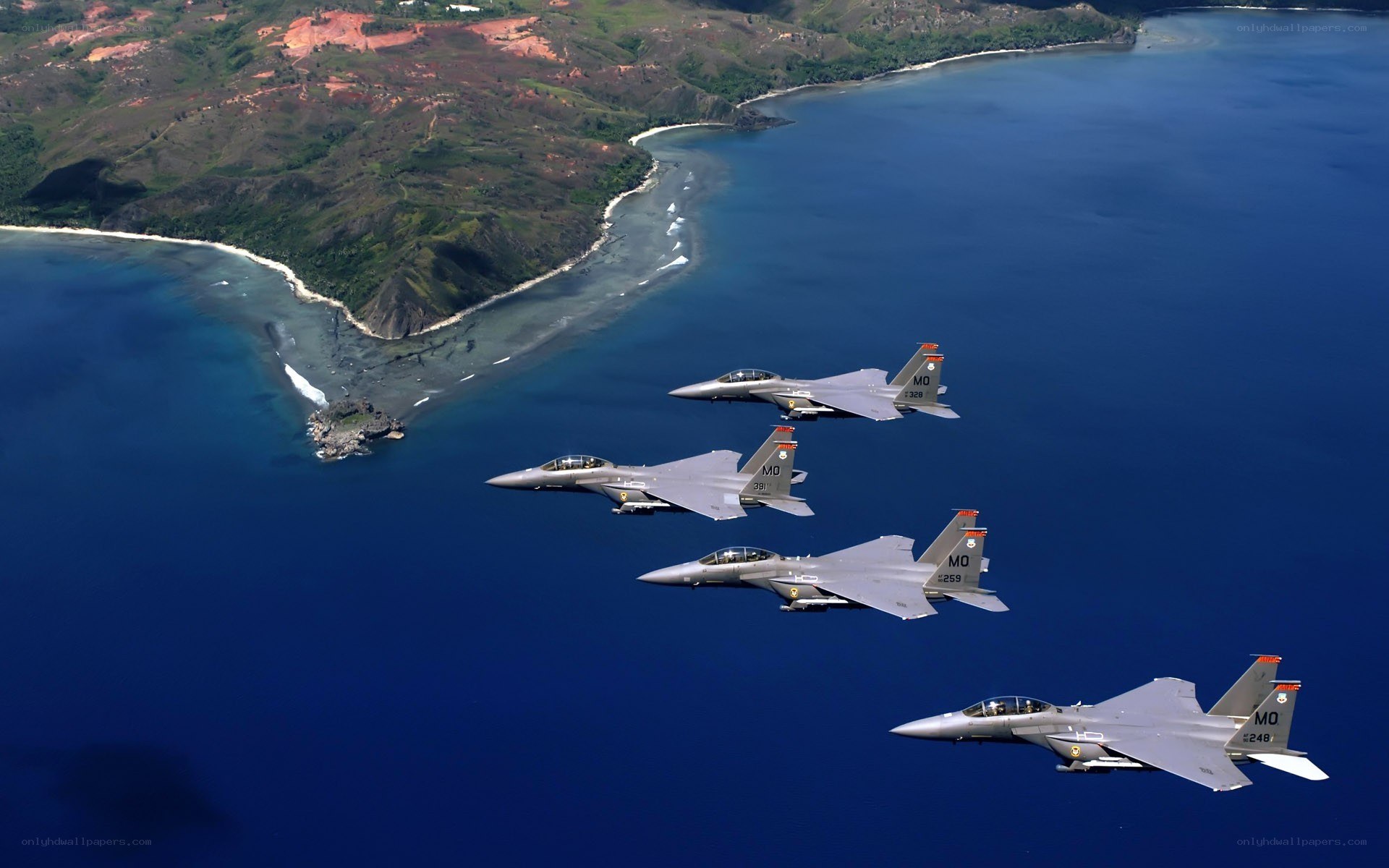 F-15 fighter jets over coastline