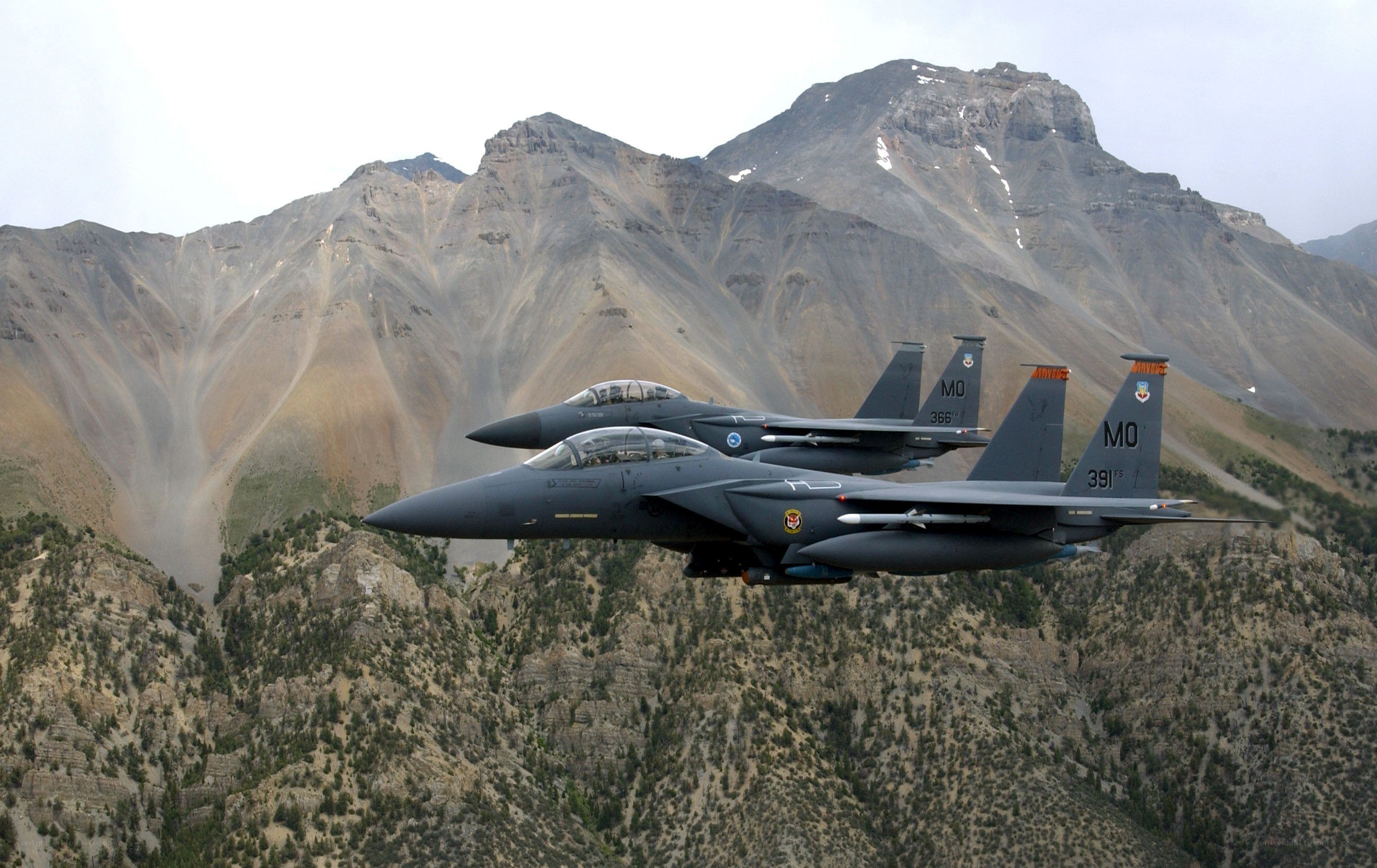 F-15 fighter jets over mountains