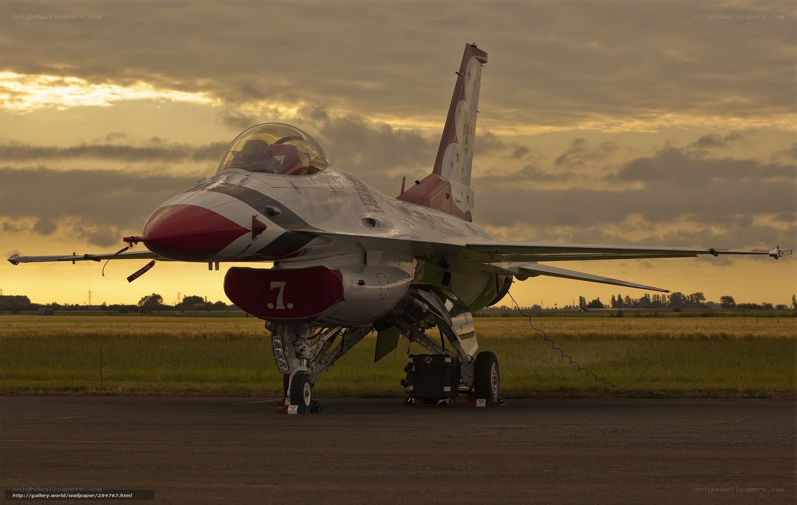 F-16 fighter jet at sunset