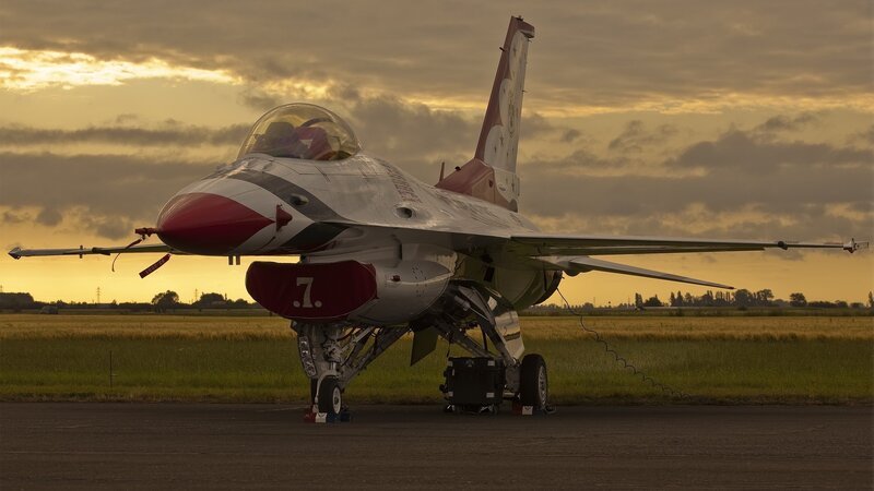 F-16 fighter jet at sunset