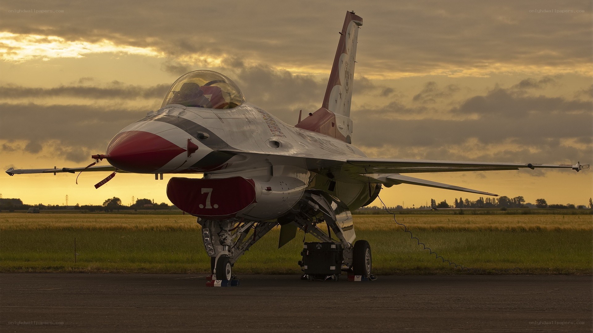 F-16 fighter jet at sunset