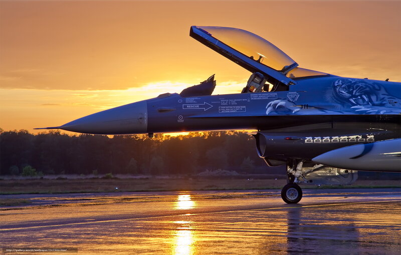 F-16 fighter jet at sunset