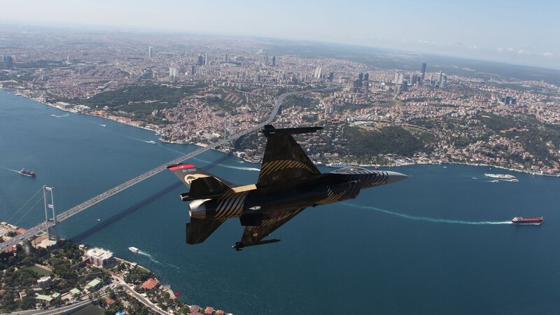 F-16 Fighter Jet — Blue, Dramatic, Afternoon, Photograph, City
