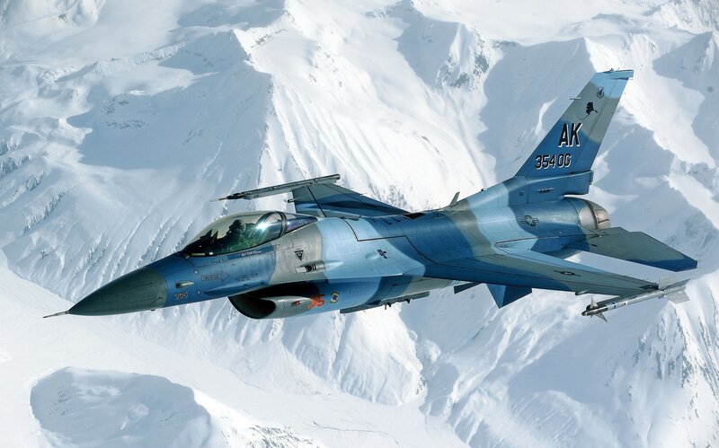 F-16 Fighter Jet — Blue, Dramatic, Winter, Photograph, Snowy Mountains