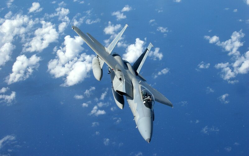 F-16 Fighter Jet — Blue, Dynamic, Afternoon, Photograph, Clouds