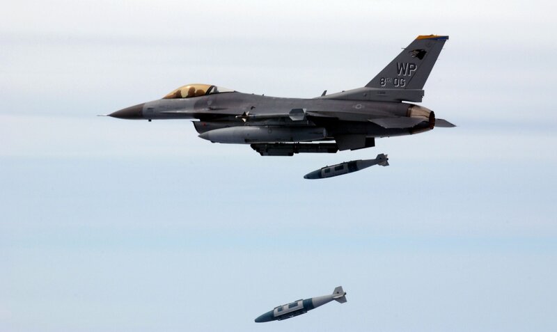 F-16 fighter jet dropping bombs