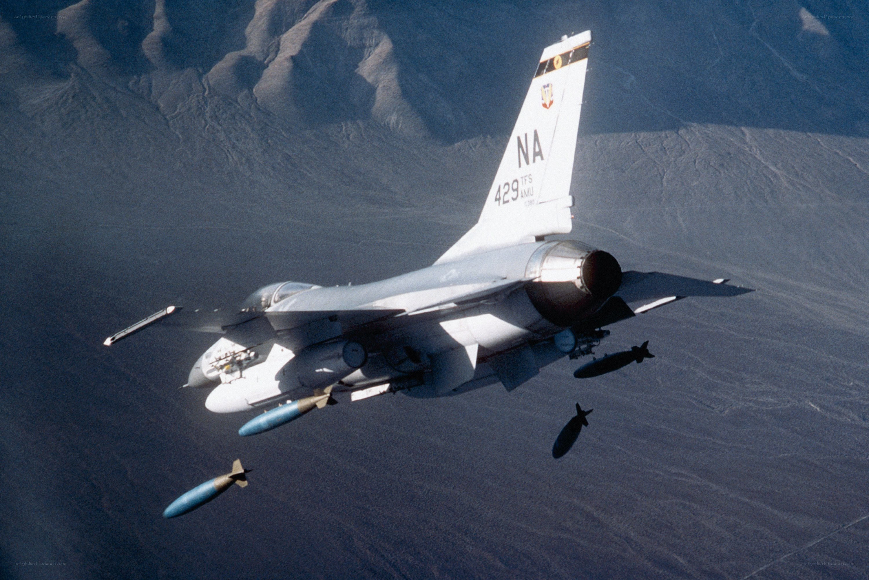 F-16 fighter jet dropping bombs