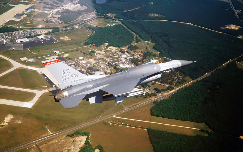 F-16 Fighter Jet — Gray, Aerial, Afternoon, Photograph, Airfield, Forest