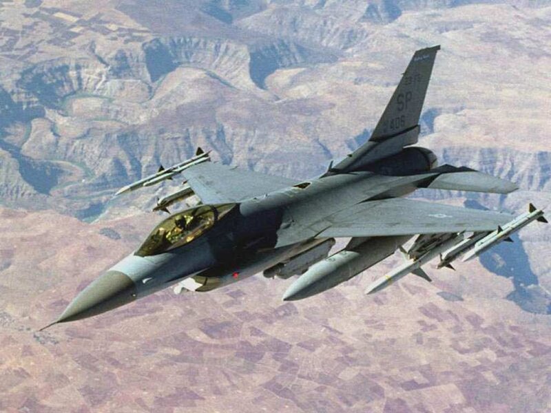F-16 Fighter Jet — Gray, Aerial, Photograph, Mountainous Terrain