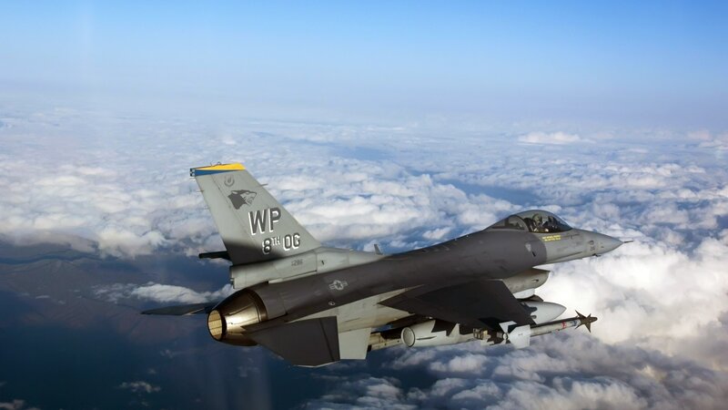 F-16 Fighter Jet — Gray, Dramatic, Afternoon, Photograph, Clouds, Mountains