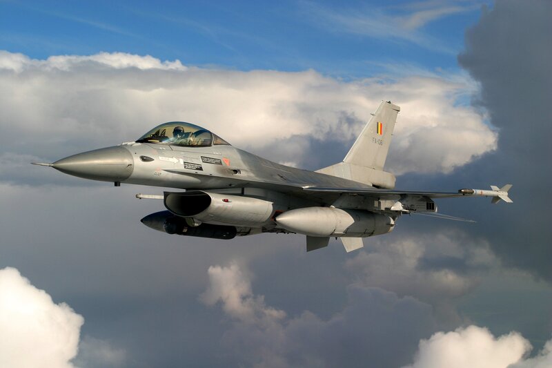 F-16 Fighter Jet — Gray, Dramatic, Afternoon, Photograph, Clouds